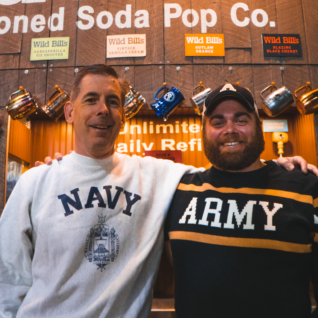 The veteran-owned Wild Bill's team in Navy and Army sweatshirts
